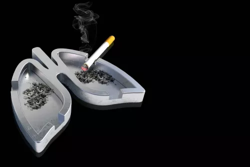 Tüdő alakú hamutál cigarettával (illusztráció)
